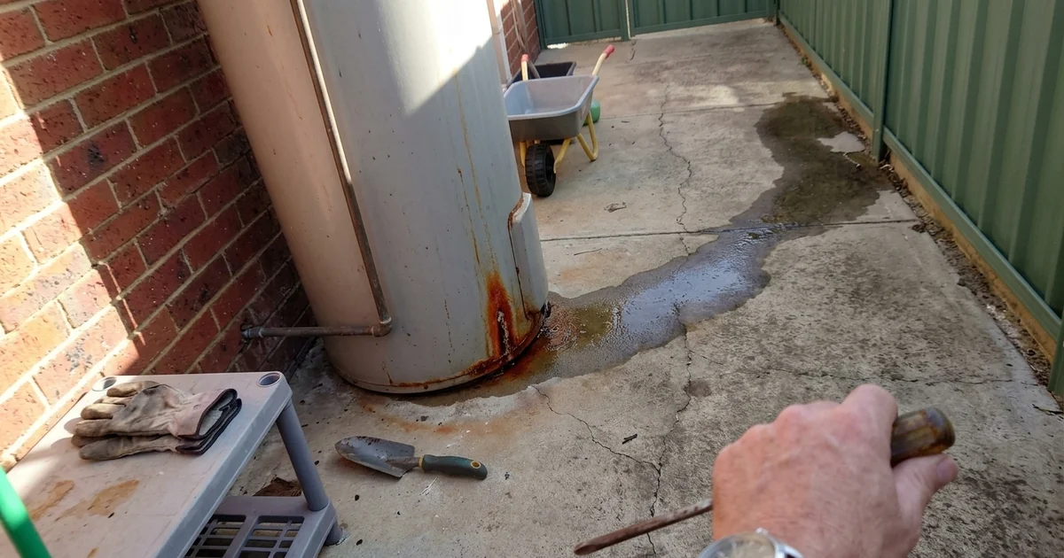 Water pooling under a hot water tank at a Perth home