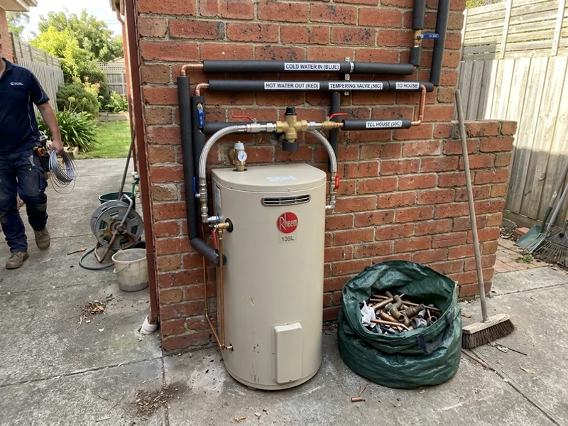Finished installation with tempering valve and labelled pipework